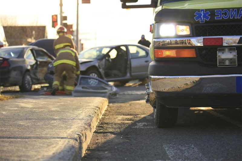 Firefighters Helping a Car Accident Victim