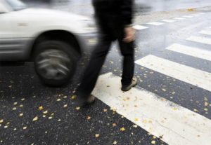 Pedestrian Walking Across the Street