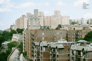 NYCHA-style public housing buildings on a Bronx hillside, featuring mid-century brick architecture and steep terrain.