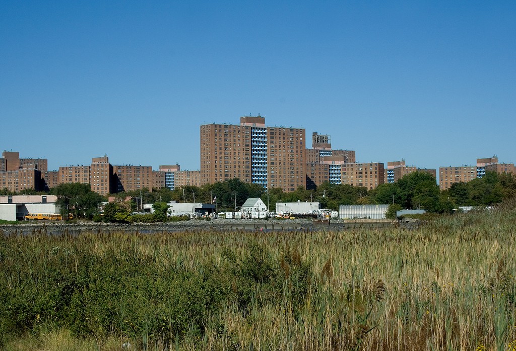 Castle Hill Houses NYCHA sign and brick buildings in the Bronx
