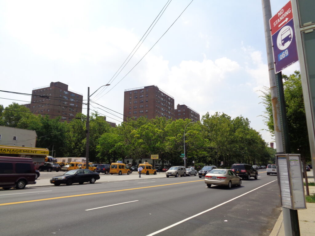 Cracked walkway pavement near Ravenswood Houses NYCHA entrance in Queens